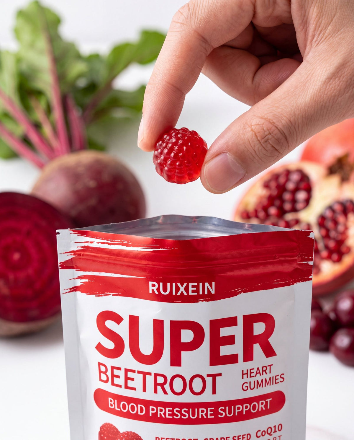 Hand holding a Super Beetroot Heart Gummies pouch